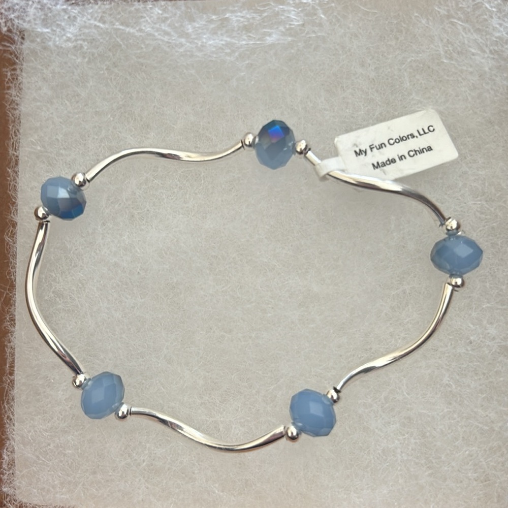 Crystal stretch silver bracelets. NWT lavender stones.